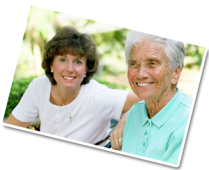 caring giver and senior sitting together